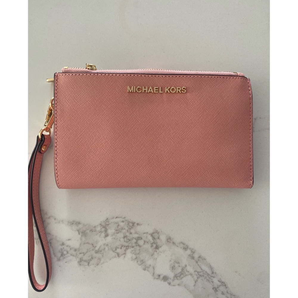 Micheal Kors plush leather pink clutch/wallet can place your phone in as well
